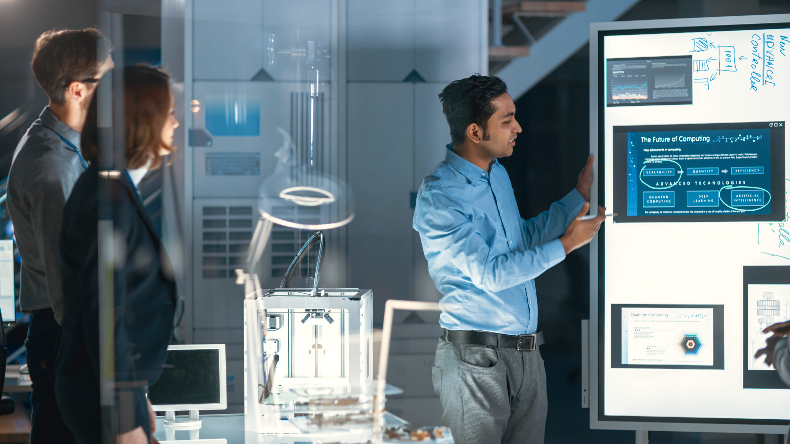 Engineers Meeting in Technology Research Laboratory: Male Engineer Leads Presentation Using Digital Whiteboard, Shows Machine Blueprint, Data Analytics and Neural Network while Colleagues Listening; Shutterstock ID 1682600935; Project Code: -; Billable/Non-billable: -; Originator Name: -